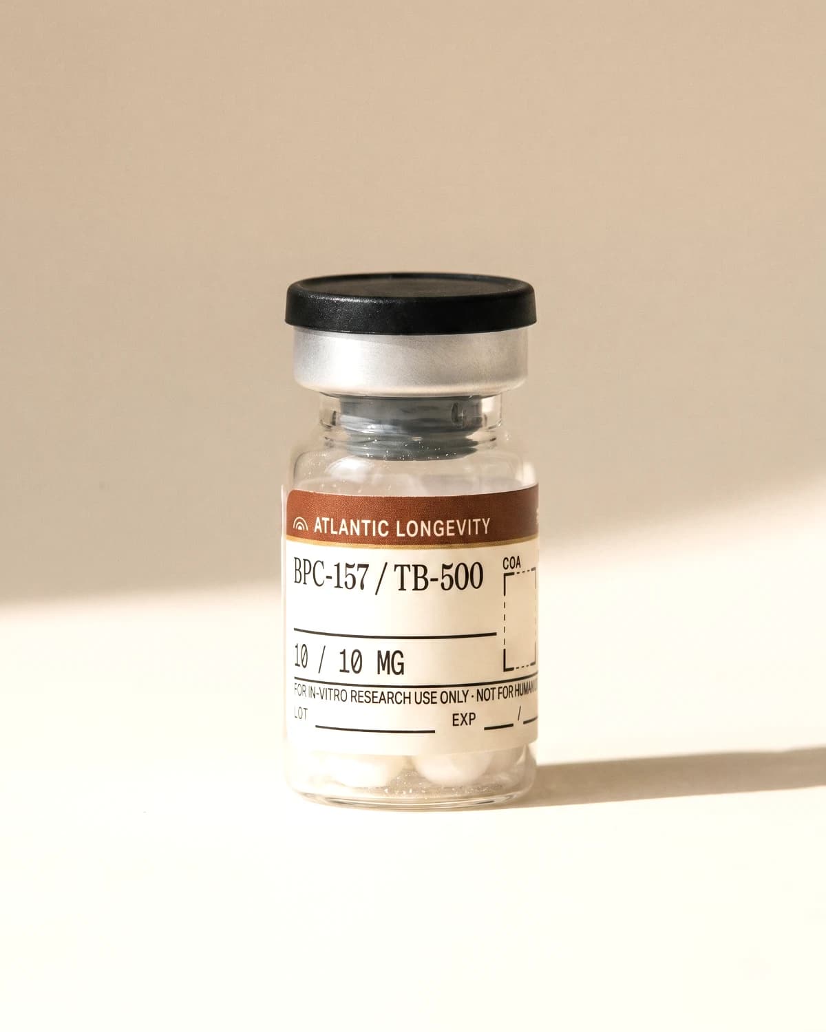 BPC-157 / TB-500 vial with Atlantic Longevity batch label, lot and expiry write-in fields, on bone paper