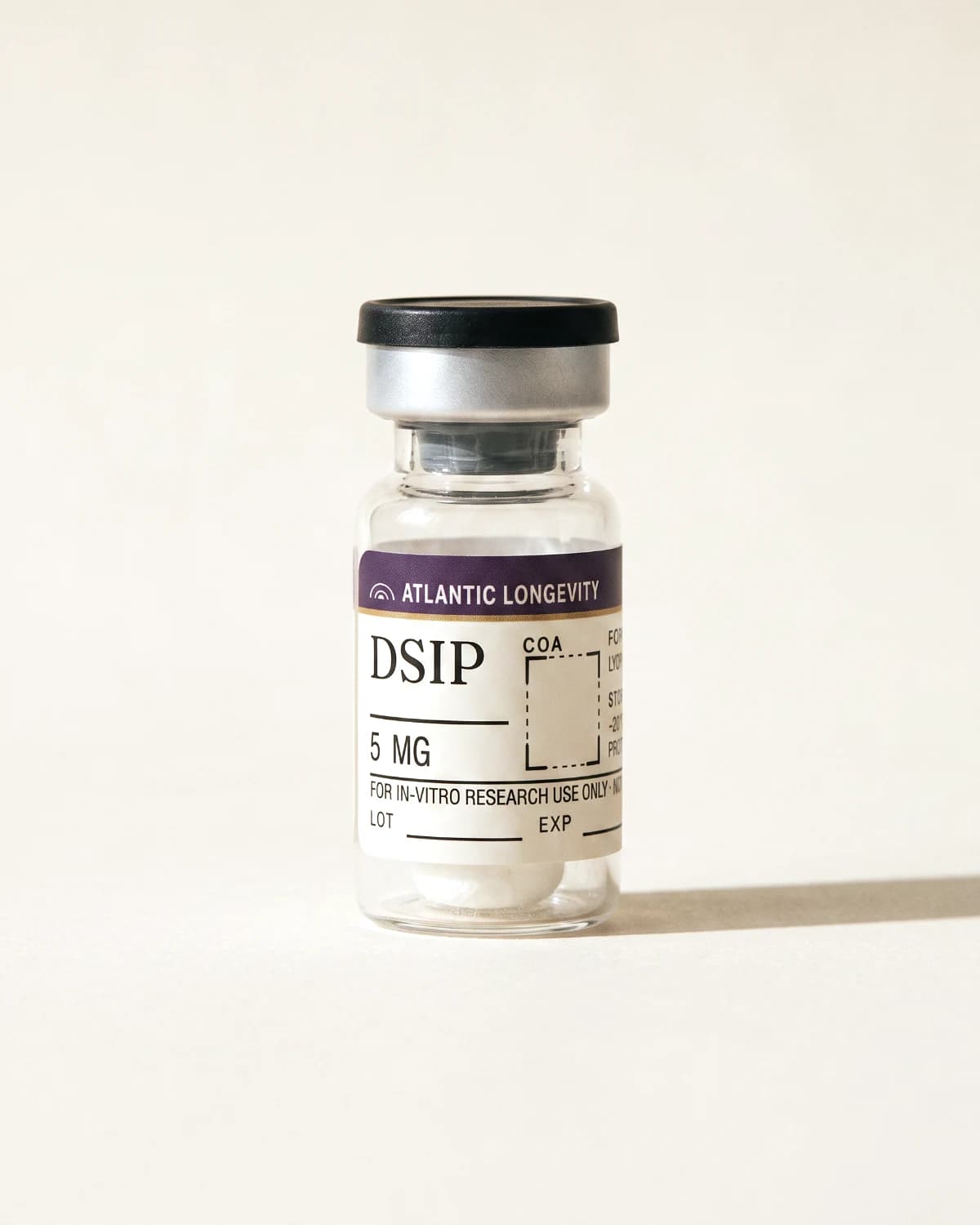 DSIP vial with Atlantic Longevity batch label, lot and expiry write-in fields, on bone paper