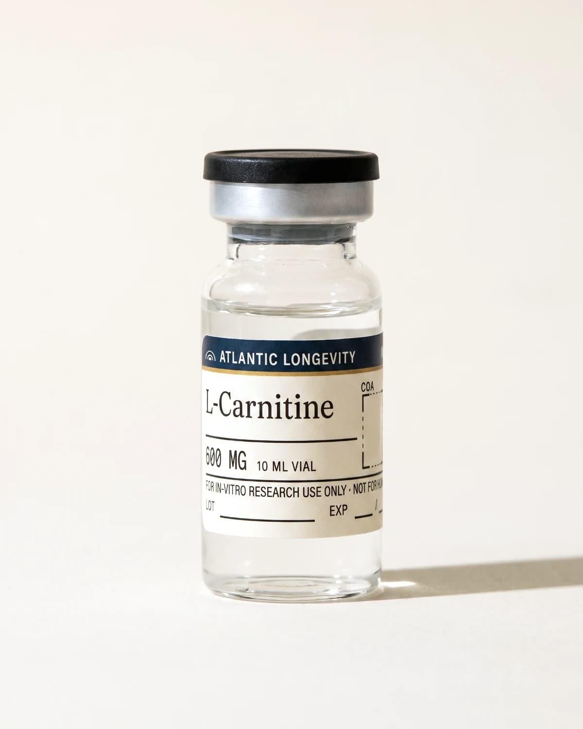 L-Carnitine vial with Atlantic Longevity batch label, lot and expiry write-in fields, on bone paper