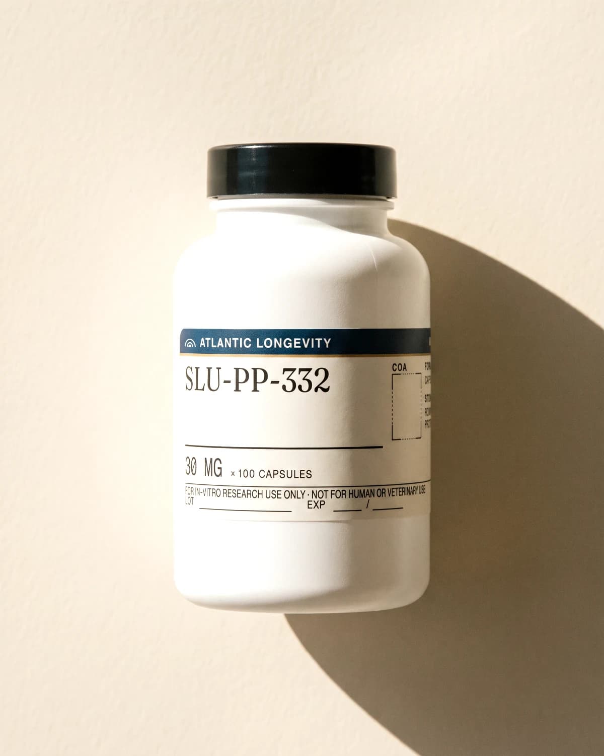 SLU-PP-332 capsule bottle with Atlantic Longevity label, on bone paper