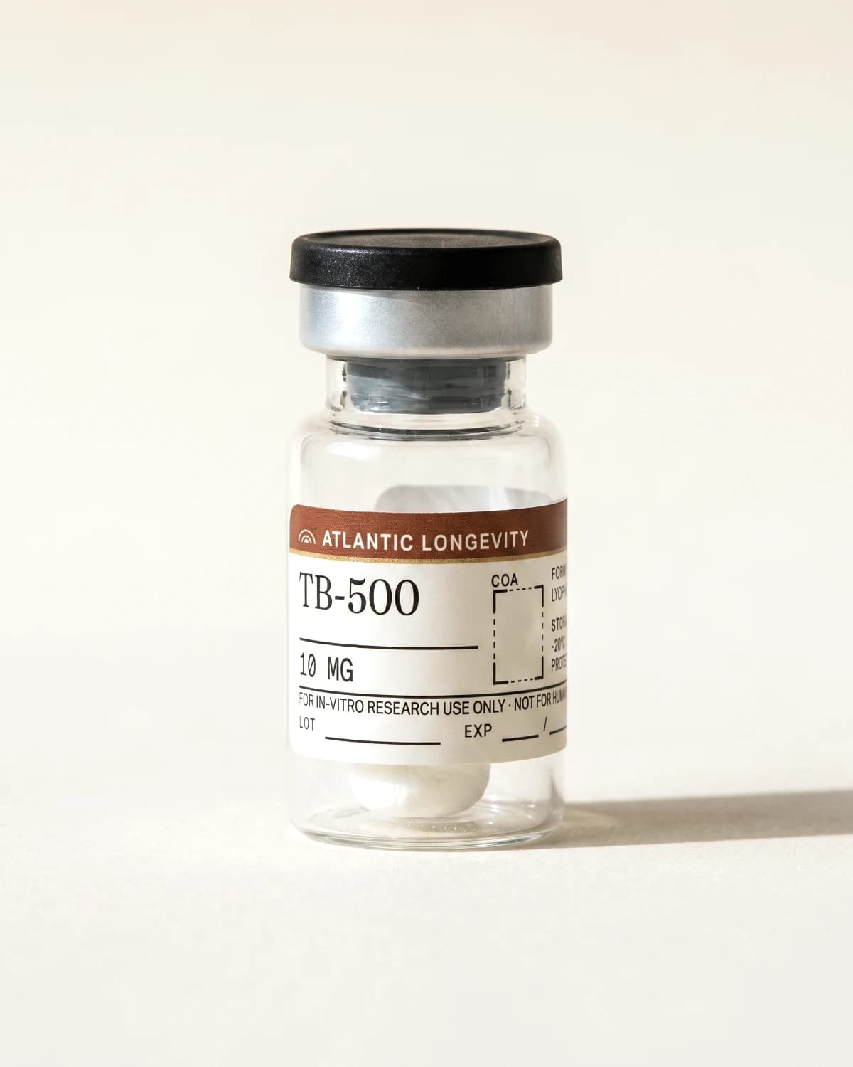 TB-500 vial with Atlantic Longevity batch label, lot and expiry write-in fields, on bone paper